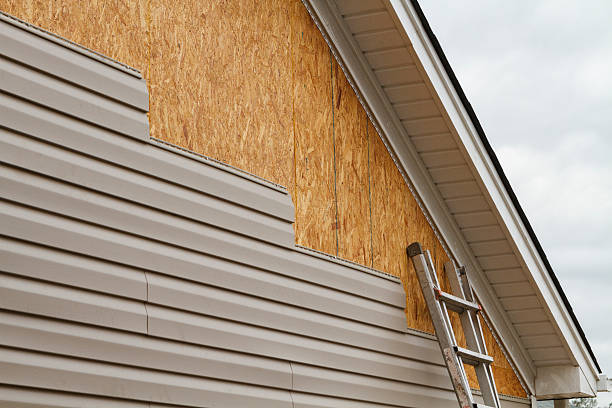 Professional Vinyl Siding technician working in Midland, PA
